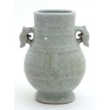 A Chinese crackle glazed celadon twin handled niutouzun vase,