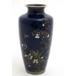 'Hitachi Tanigoro' : A Japanese enamelled fine Cloisonne work vase with silver rim and top.