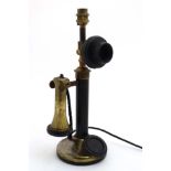 A table lamp in the form a a candlestick telephone 14 3/4" high CONDITION: Please