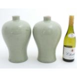 A pair of Chinese celadon glazed Meiping vases. 12'' high.