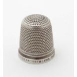 A silver thimble marked ' Sterling Silver 17 ' The Spa' Made in England' maker Henry Griffith &