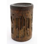 A 19thC Chinese carved bamboo brush pot with lid.. Bears painted symbols under.