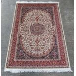 Carpet / Rug :A beige ground Keshan style carpet measuring 63 1/2 x 96 1/2" CONDITION: