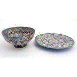 A 20thC Persian enamelled pedestal bowl and matching plate.