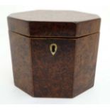 A Georgian burr yew neoclassical tea caddy of lozenge shape.