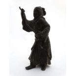 An 18thC / 19thC cast and patinated Oriental bronze figure holding a removable staff.