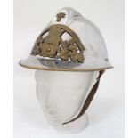 Fireman : A nickel and brass fireman's helmet with brass embossed badge marked Sapeurs Pompiers