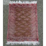 Carpet / Rug : A handmade woollen prayer rug with fringe,