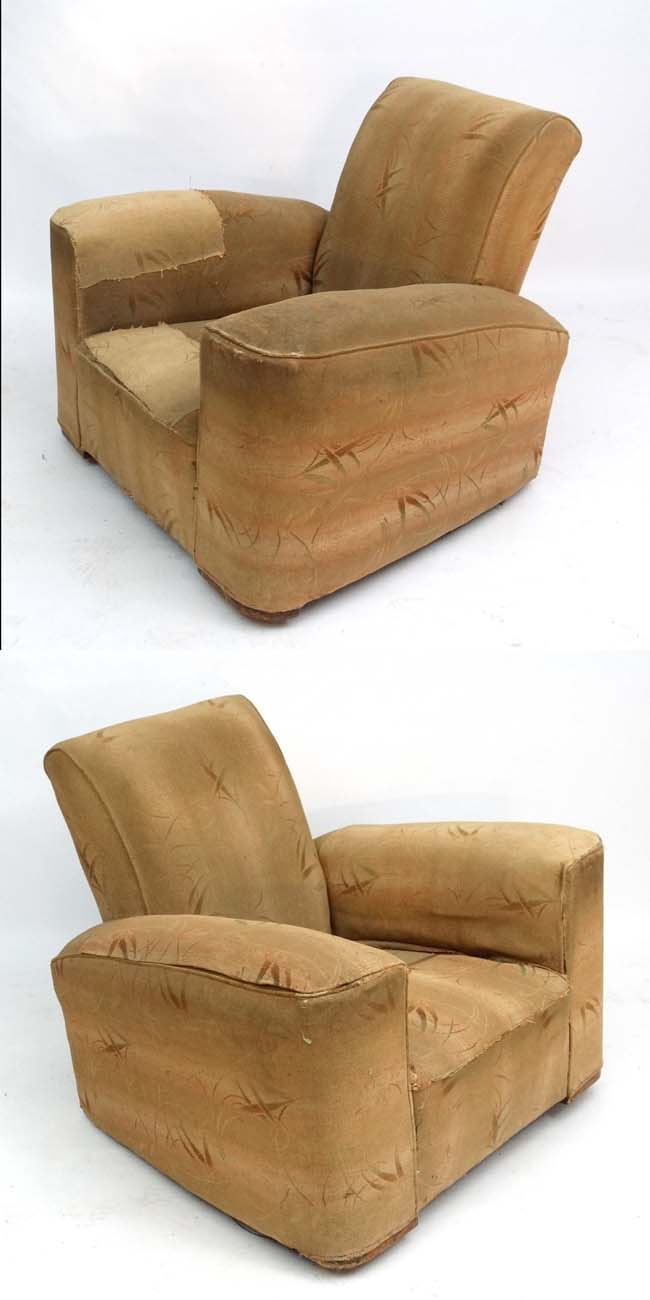 A pair of Art Deco cloth upholstered club armchairs.