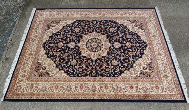 Carpet / Rug: A machine made Persian Keshan style carpet with midnight blue / black central - Image 6 of 7