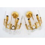 Mid Century / Hollywood/Regency : a pair of gilt wall lights with droplets and prismatic uprights,