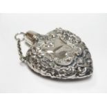 Silver heart formed small perfume bottle