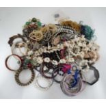 A very large quantity of assorted costume jewellery to include bracelets,