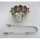 A silver plated sugar bowl and silver plated fiddle pattern sugar tongs CONDITION: