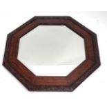 Oak framed octagonal mirror with bevelled glass CONDITION: Please Note - we do not