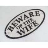 A 21st C novelty oval cast metal sign "Beware of the Wife" 7" wide CONDITION: Please