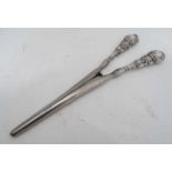 A pair of silver handled glove stretchers CONDITION: Please Note - we do not make