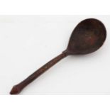 A Norwegian? small red lacquered spoon, with painted decoration to interior of bowl,