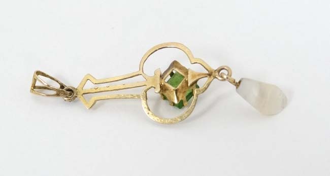 A gilt metal pendant set with green stone and mother of pearl drop CONDITION: - Image 2 of 4