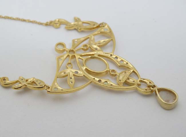 A silver gilt pedant and chain, the open work pendant set with a profusion of opals. - Image 4 of 5