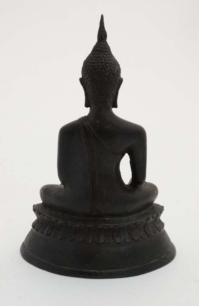 An Oriental cased patinated bronze figure of a seated buddaha on lotus flower base, - Image 4 of 4
