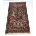 Carpet / rug : an Iranian Kerman early 20 thC hand knotted rug, with birds, Rabbits, and deer etc,