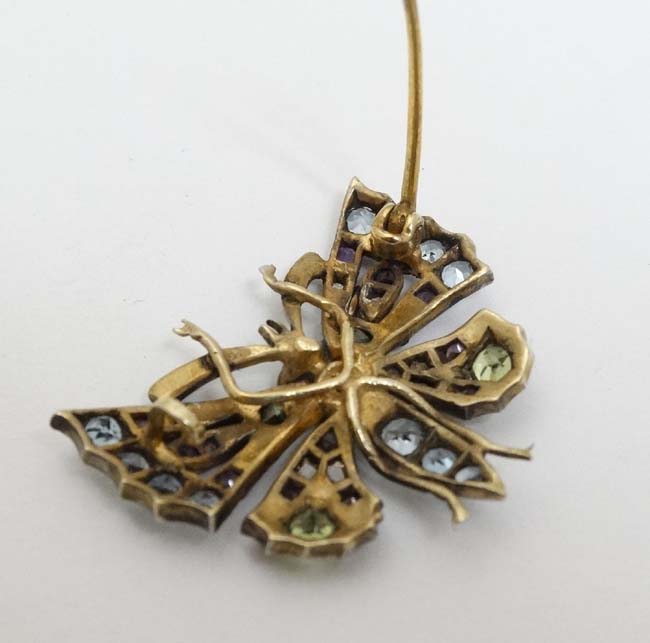 A yellow and white metal brooch formed as a butterfly set with a profusion of stones including - Image 2 of 4