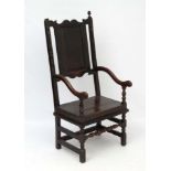 A Jacobean oak oversized elbow chair of peg jointed construction 54 1/2" high x 24" wide