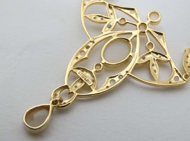 A silver gilt pedant and chain, the open work pendant set with a profusion of opals. - Image 5 of 5