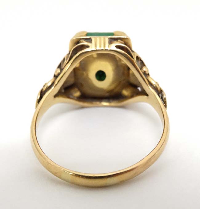 A Chinese 22ct gold ring set with jade like hardstone stone to top CONDITION: Please - Image 4 of 6