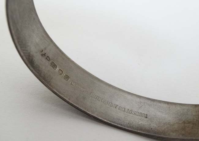 A silver bangle hallmarked London 1976 maker Maylin Products Ltd ( of Grovebury Road, - Image 2 of 4