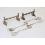 Kitchenalia : a pair of silver plated knife rests together with four ornat cast silver plate