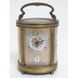 Carriage Clock: a French '9 Aout 1906' ( marked to top) oval carriage clock ,