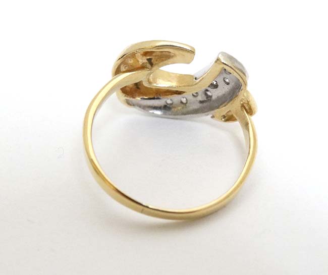 A 9ct gold ring with abstract design to top set with band of diamonds CONDITION: - Image 4 of 4