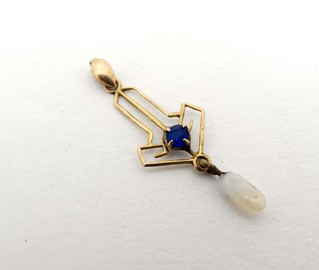 A 10k gold pedant set with blue stone and white chip drop 1” long CONDITION: Please