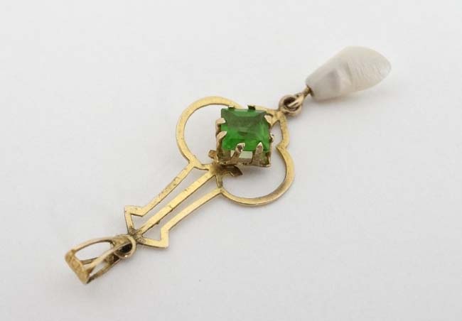 A gilt metal pendant set with green stone and mother of pearl drop CONDITION: - Image 4 of 4