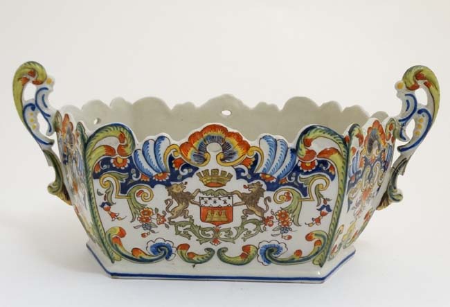 A 19thC Dinan, France, Faience pottery twin handlled jardiniere in a Quimper style,