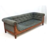 Aesthetic Movement : a late 19 thC button back sofa with foliate upholstery, oak showwood ,