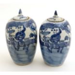 A pair of small Chinese blue and white jars with covers,