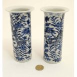 A small pair of Chinese blue and white flared rim cylinder vases,
