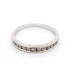 An 18ct white gold half eternity ring set with 12 diamonds CONDITION: Please Note