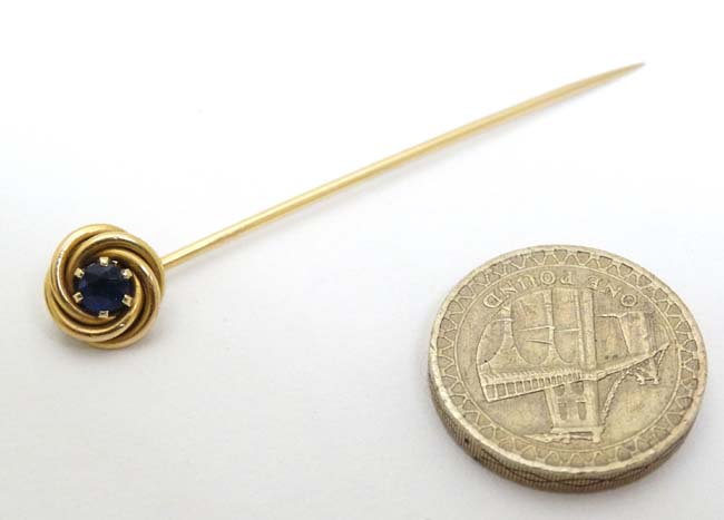 A 14k gold stick pin surmounted by a blue stone 2 ½" long CONDITION: Please Note - - Image 3 of 4