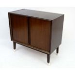 Vintage Retro : a 1950-60's dark walnut TV/Music cabinet standing on 4 legs with double tambour