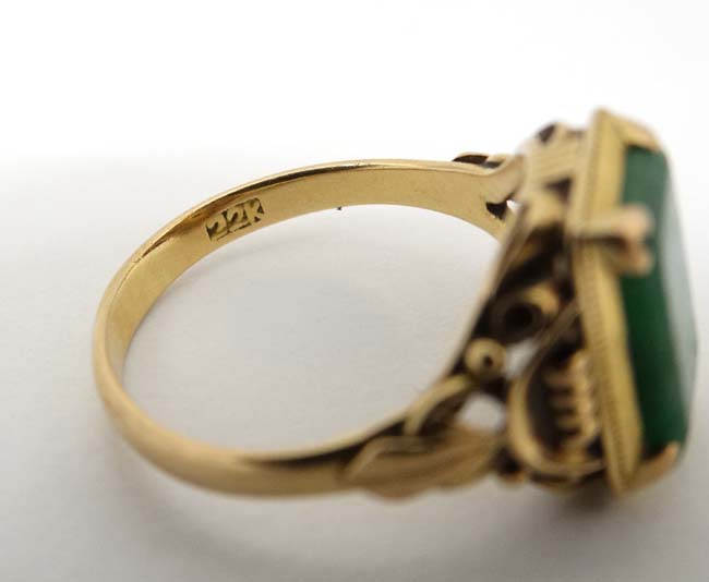 A Chinese 22ct gold ring set with jade like hardstone stone to top CONDITION: Please - Image 2 of 6