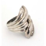 A silver dress ring with stylised lobed decoration CONDITION: Please Note - we do