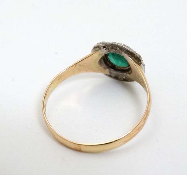 A 15ct gold ring set with central emerald bordered by diamonds CONDITION: Please - Image 4 of 5