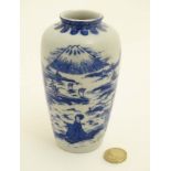 A small blue and white Japanese vase,