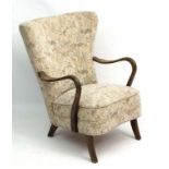 Vintage Retro : A Danish Art Deco open armchair with shaped back and short sabre like front legs.