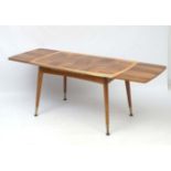 Vintage Retro : a most unusual ( and clever!) draw leaf walnut table having crank handled