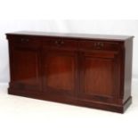 Brights of Nettlebed : A mahogany triple sideboard with secretaire cutlery drawer to centre 70"